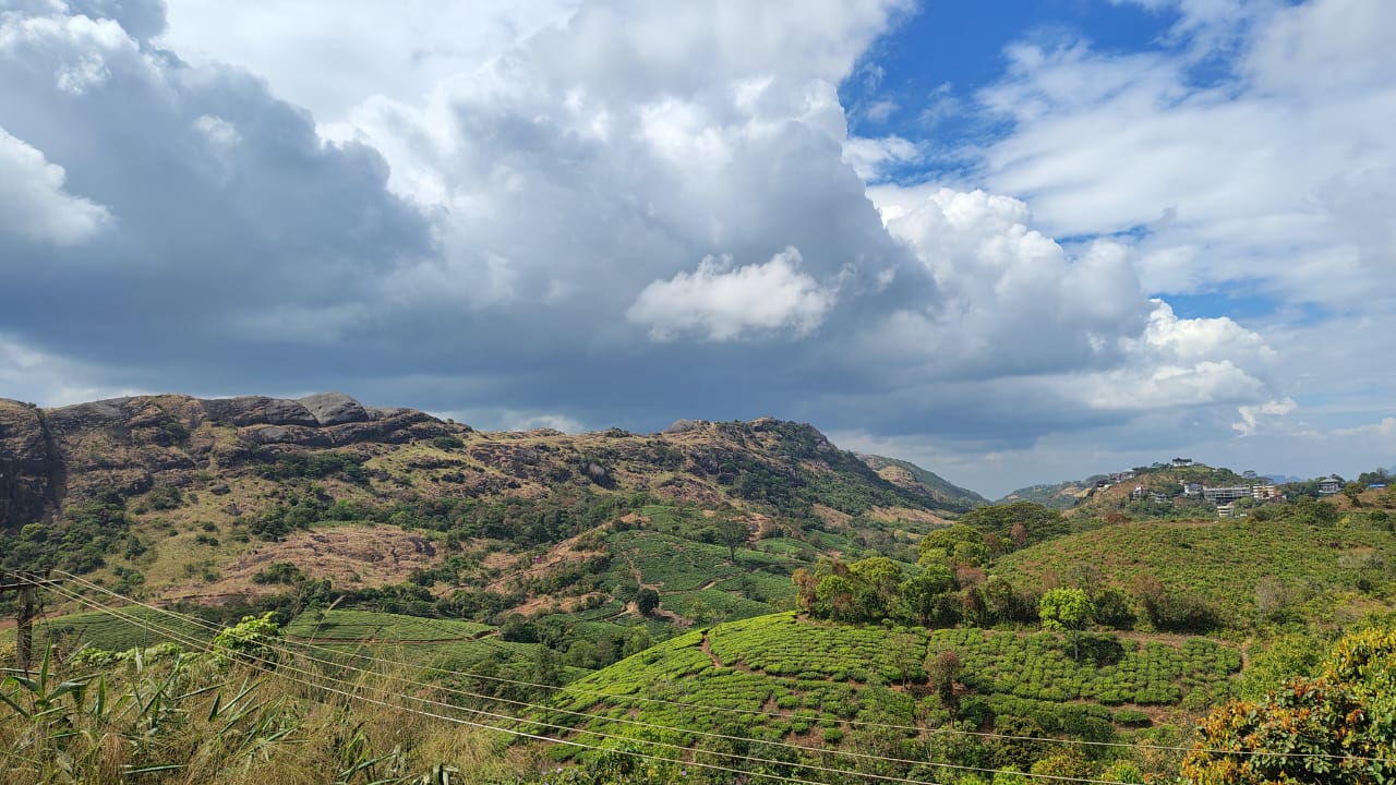 Storm clouds over the rocky hills and tea gardens of Vagamon, Kerala