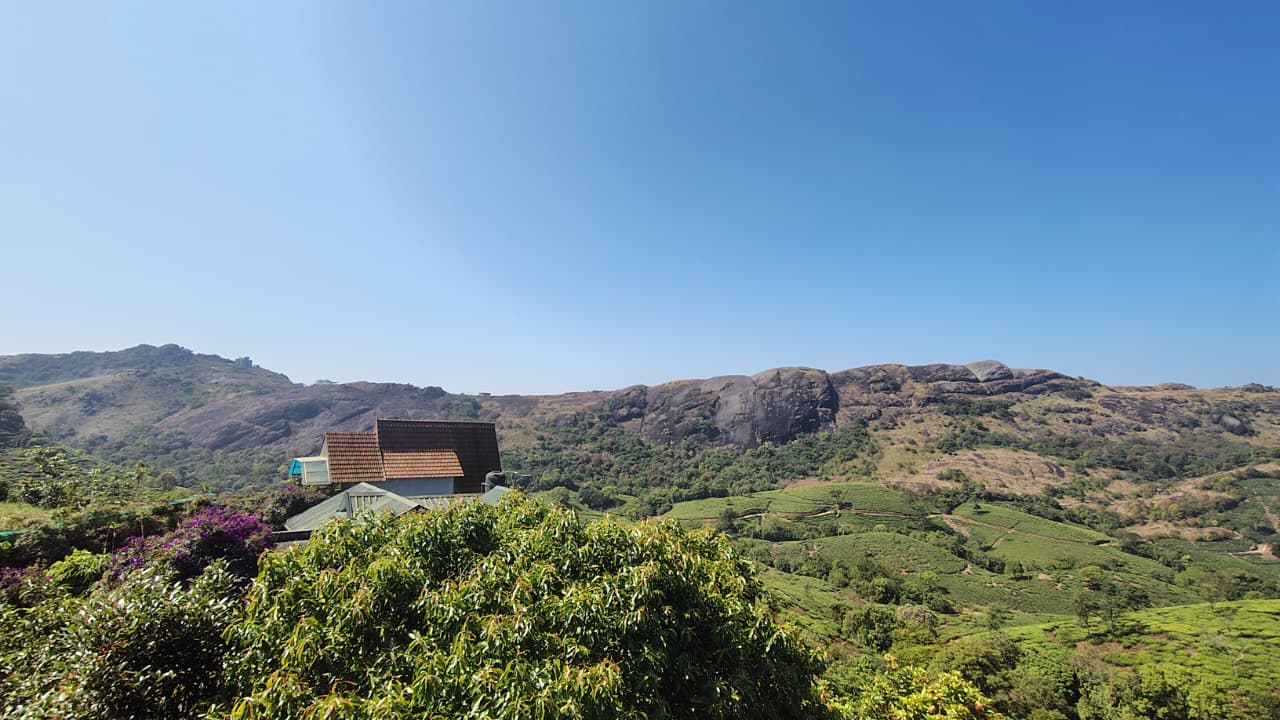 Cottage among tea gardens below the granite cliffs of Vagamon